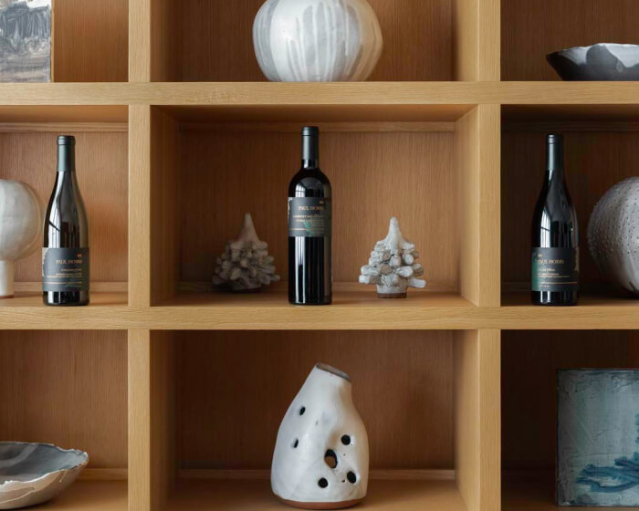 Shelf with paul hobbs wines and vases